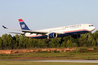 N277AY @ KCLT - Lit by the setting sun after a long flight from England. - by Jamin