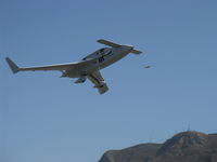 N57LG @ SZP - 1983 Godsey/Klaus Savier modified RUTAN VARI-EZE 'DELIMINATOR III', Continental O-200 100+ Hp, Light Speed Engineering plasma ignition, multiple FAI World records holder, takeoff climb Rwy 22, nose gear retracted - by Doug Robertson