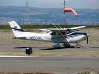 N2214L @ SQL - 2005 Cessna 182T waiting its turn for take-off - by Steve Nation