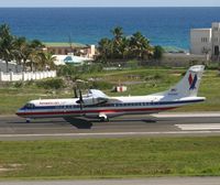 N369AT @ TNCM - American eagle landing on runway 10 - by Daniel Jef