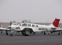 N8294M @ KAPC - Shown in latest colors - mechanic taxiing Japan Airlines 1992 Beech A36 for day's training flights- foggy morning at KAPC home base - by Steve Nation