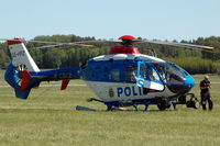 SE-HPZ @ ESOW - Swedish police helicopter with its pilot at Västerås Hässlö airport, Sweden.