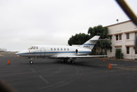 N100LA @ KOAK - Racine, WI-based 1995 Raytheon Corporate Jets Inc HAWKER 800XP visiting North Field @ KOAK (why didn't I use my Powershot 710 with fence busting smaller lense? Note to Steve - duh!). - by Steve Nation