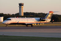 N435AW @ ORF - US Airways Express (Air Wisconsin) N435AW (FLT AWI4071) taxiing to RWY 23 for departure to Reagan National (KDCA) late in the day.