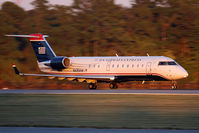 N435AW @ ORF - US Airways Express (Air Wisconsin) N435AW (FLT AWI4071) on takeoff roll on RWY 23 enroute to Reagan National (KDCA) late in the day.