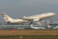 A6-EYJ @ EGCC - Climbing away from Runway 05L. - by MikeP