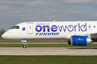 OH-LKN @ EGCC - Close up with Finnair's Embraer logo-jet. - by MikeP
