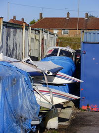 EI-CIJ @ EGGP - between the containers at Liverpool Airport - by Chris Hall