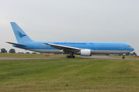 G-OBYE @ EGGW - Thomson B767 in Garuda International colours at Luton - by Terry Fletcher