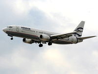 SX-BLM @ EGGP - Aegean Airlines - by Chris Hall