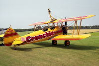 N54922 @ X2BD - Boeing A75N1. A wing walkers mount at Badminton Air Day, Badminton House, UK in 1990. - by Malcolm Clarke