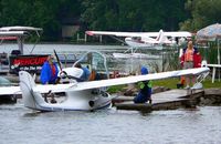 N338SM - A wet and drizzly day at the Oshkosh sea base - by Nathan Margo