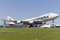 LX-GCV @ ELLX - departing Luxemburg via RW06 - by FBE