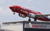 VH-VBL @ BNE - VirginBlue 737 over VirginBlue Maintenance Facility