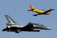 FA-134 @ EBBL - Nice formation of the new display F-16 and tiger marked SF-260 ST-48. FA-134 had some problems to keep pace with the slow mover.