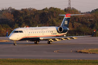 N423AW @ ORF - US Airways Express (Air Wisconsin) N423AW (FLT AWI3719) exitting RWY 5 after arrival from Philadelphia Int'l (KPHL) late in the day.