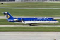 N710BR @ KSAT - Midwest CRJ-200 taxies to its stand - by FBE