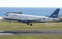 N583JB @ TNCM - Jet blue landing at tncm