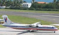 N407AT @ TNCM - american eagle taxing to holding point A