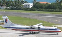 N407AT @ TNCM - american eagle taxing to holding point A - by Daniel Jef