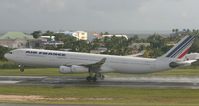 F-GLZT @ TNCM - Airfrance landing on a very wet day. - by Daniel Jef
