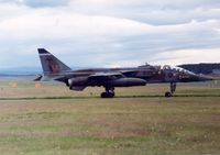 XX841 @ EGQS - Jaguar T.2A of 6 Squadron awaiting take-off clearance at Lossiemouth in the Summer of 1992. - by Peter Nicholson