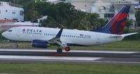 N310DE @ TNCM - Delta airlines doing there thing