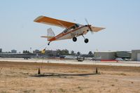 N612AP @ KLGB - Picking up a banner. Note the hook inches from the ground - by Nick Taylor Photography