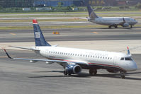 N948UW @ KEWR - A brand-new US Airways regional jet taxies in at Newark. - by Daniel L. Berek