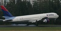 N125DL @ TJSJ - Delta main landing gear on the ground