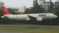 N319US @ TJSJ - NWA landing at TJSJ