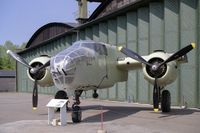 N7614C @ EGSU - North American B-25J Mitchell under renovation at The Imperial War Museum Duxford in 1990. - by Malcolm Clarke