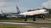 N939UW @ TNCM - US airways landing at TNCM