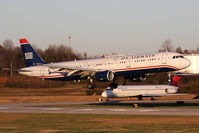N195UW @ CLT - US Airways N195UW (FLT AWE770) from San Francisco Int'l (KSFO) landing RWY 18C, with a Delta Air Lines DC-9 N768NC holding short. - by Dean Heald