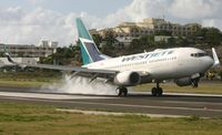 C-FWAQ @ TNCM - Westjet landing at TNCM