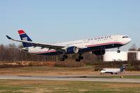 N273AY @ CLT - US Airways N273AY (FLT AWE733) from London Gatwick (EGKK) arriving to RWY 18C, while US Airways Express (Air Wisconsin) N432AW holds short. - by Dean Heald