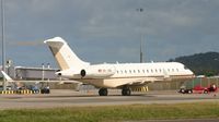 HB-JGE @ TNCM - HB_JGE being taken from the general aviation parking to the Bravo ramp for parking