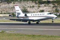 N389QS @ TNCM - N389QS landing at TNCM on runway 10