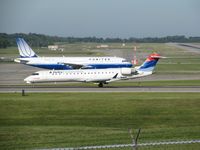 N391CA @ KCVG - Passing by a rare non-Delta visitor (N465UA) on her takeoff roll - by Kevin Kuhn
