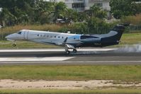 N918JT @ TNCM - Main landing gear down for the N918JT on runway 10 - by SHEEP GANG