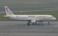 TS-IMF @ EBBR - Heading to 07R for departure in the pouring rain. - by MikeP