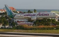 9Y-ANU @ TNCM - Caribbean airlines 737 departing TNCM on runway 28 with an early gears up!!! - by Daniel Jef