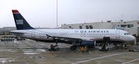 N657AW @ KMCO - At the gate at MCO on a rainy New Years. - by Kreg Anderson
