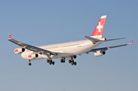 HB-JMC @ KORD - Swissair A340-313, SWR84T, arriving RWY 28 KORD from LSZH (Zurich). - by Mark Kalfas