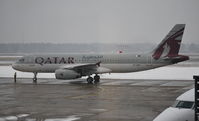 A7-ADU @ EDDT - A320 at snowy Berlin-Tegel - by moxy