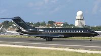 G-CEYL @ TNCM - G-CEYL back tracking the active runway for parking on the cargo ramp - by Daniel Jef
