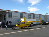 N7523T @ SZP - 2004 Robinson R-44 RAVEN II, Lycoming IO-540 derated to 245 Hp for 5 minutes, 205 Hp continuous, respotting to get Turbine Legend N724RX out of hangar to fly. - by Doug Robertson