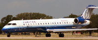 N159GJ @ KAUS - GJS/UALX prepares to roll on 17L. - by Darryl Roach