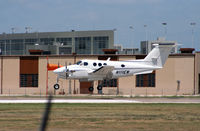N111EN @ KAUS - F90 touches down 17L. - by Darryl Roach