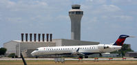 N607LR @ KAUS - DALX departs 17L with a beautiful backdrop of the Tower. - by Darryl Roach